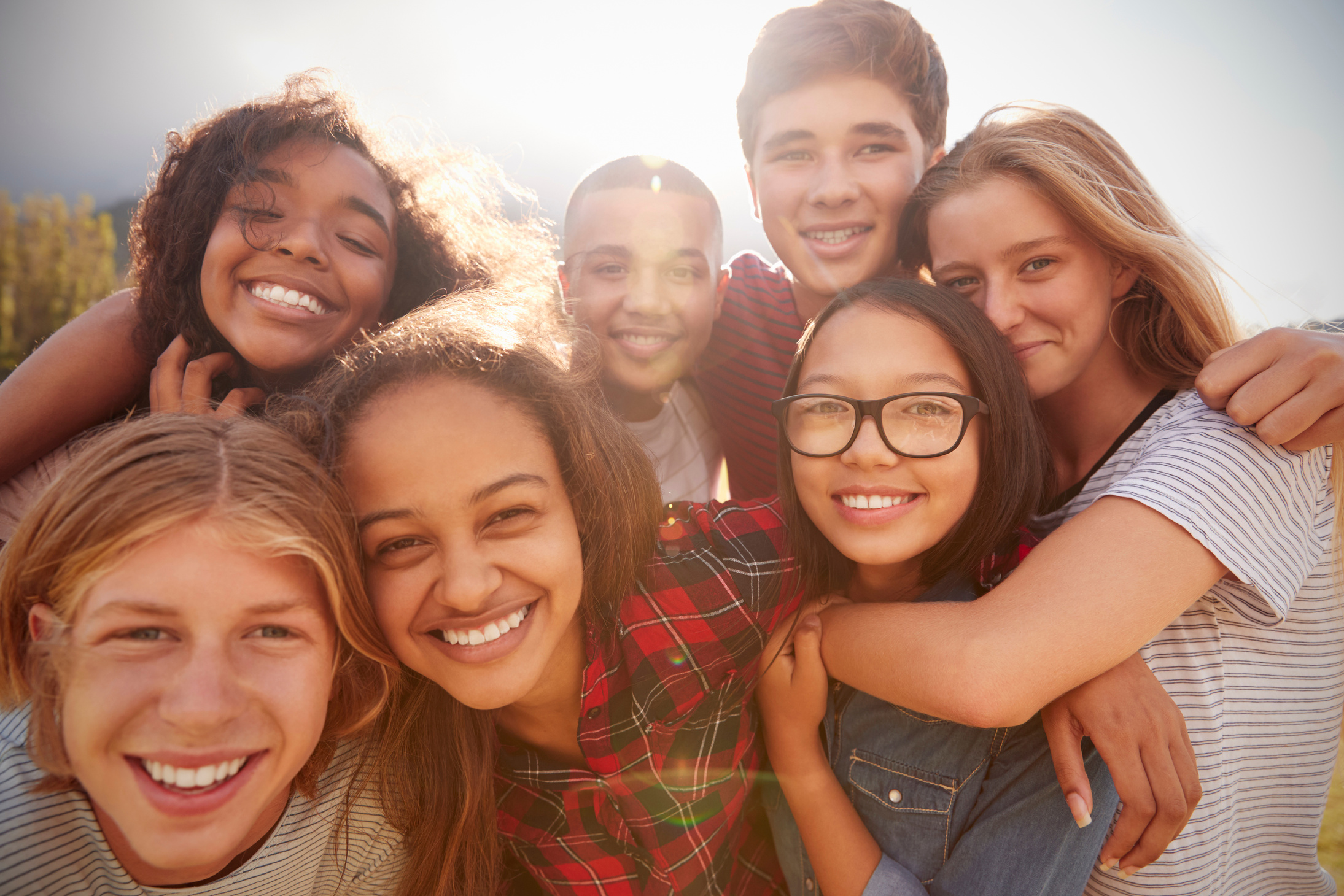 Teenage School Friends Smiling to Camera